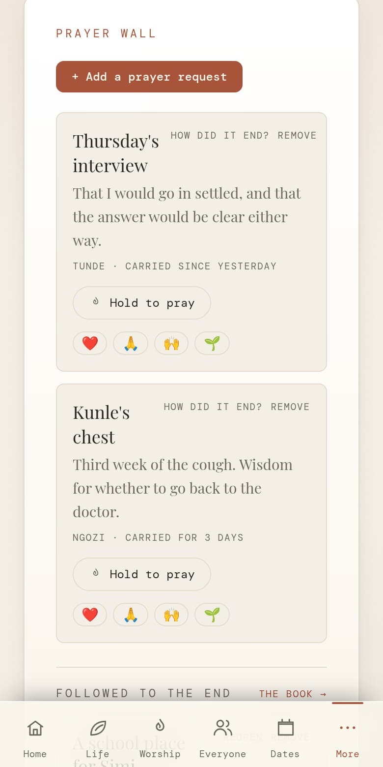 The prayer wall on a phone, with two requests a household is carrying, each showing who asked and how long it has been carried, a hold-to-pray button, and a link to the requests that have been followed to the end.